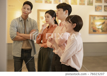 People with guide at exhibition in art gallery 028 76023207