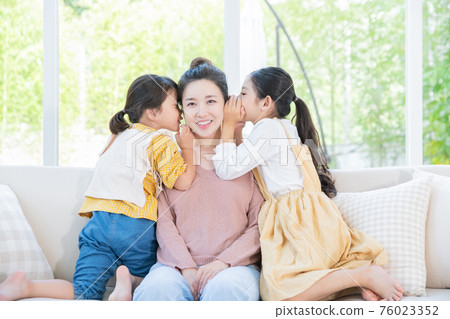 Portrait of happy cheerful family, young mother and two daughters 037 76023352