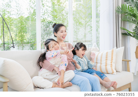 Portrait of happy cheerful family, young mother and two daughters 097 Portrait of happy cheerful family, young mother and two daughters 097 76023355