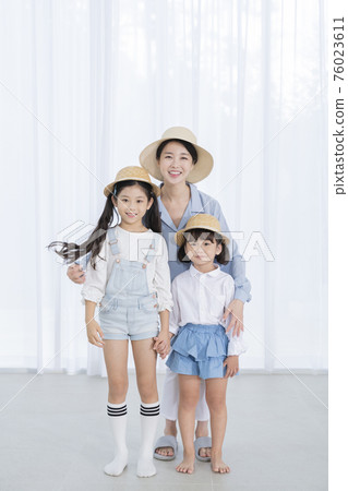 Portrait of happy cheerful family, young mother and two daughters 380 Portrait of happy cheerful family, young mother and two daughters 380 76023611