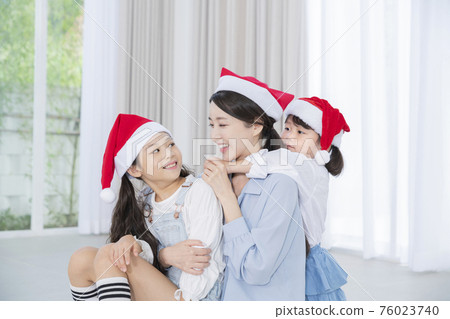 Portrait of happy cheerful family, young mother and two daughters 386 Portrait of happy cheerful family, young mother and two daughters 386 76023740