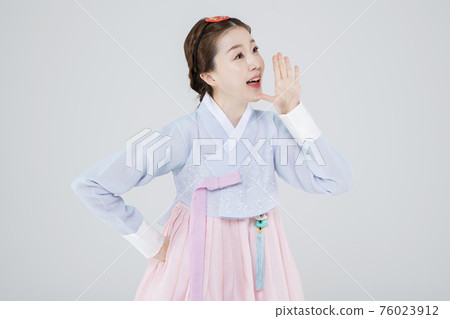 Male and female in Korean traditional clothes Hanbok 021 76023912