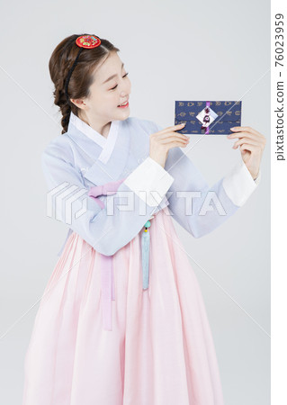 Male and female in Korean traditional clothes Hanbok 107 76023959