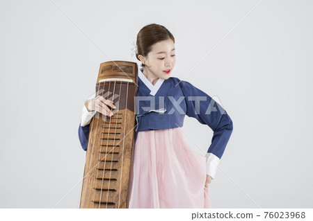 Male and female in Korean traditional clothes Hanbok. comic humorous concept. 090 76023968