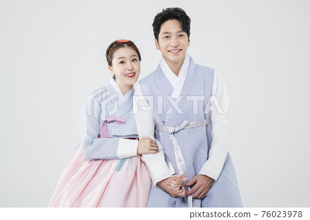 Male and female in Korean traditional clothes Hanbok 174 76023978