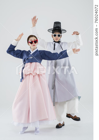 Male and female in Korean traditional clothes Hanbok. comic humorous concept. 052 76024072
