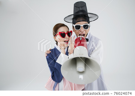 Male and female in Korean traditional clothes Hanbok. comic humorous concept. 041 76024074