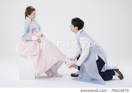 Male and female in Korean traditional clothes Hanbok 176 76024078