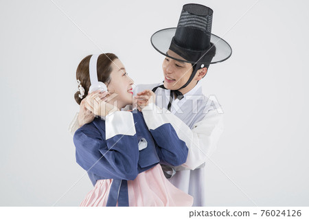 Male and female in Korean traditional clothes Hanbok. comic humorous concept. 121 76024126