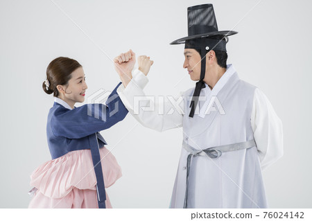 Male and female in Korean traditional clothes Hanbok. comic humorous concept. 107 76024142