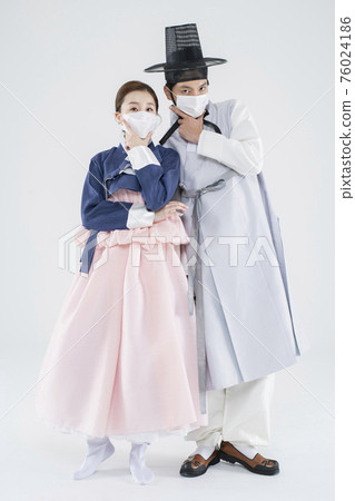 Male and female in Korean traditional clothes Hanbok. comic humorous concept. 139 76024186