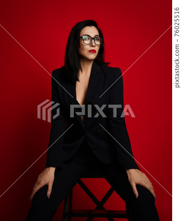 Adult businesswoman in official pantsuit with deep Adult businesswoman in official pantsuit with deep 76025516
