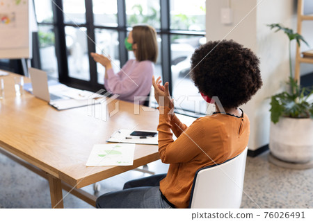 Diverse group of business people working in creative office Diverse group of business people working in creative office 76026491