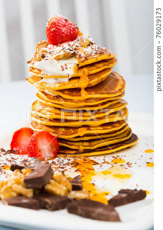 Pumpkin pancakes with sauce Pumpkin pancakes with sauce 76029173