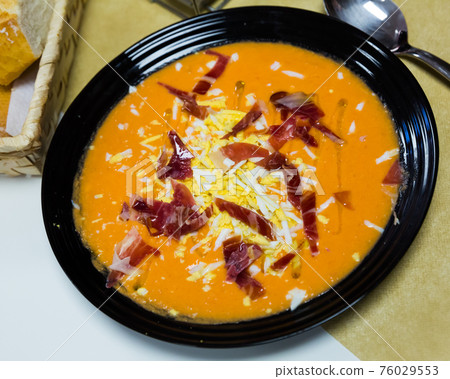 Salmorejo with jamon and boiled egg Salmorejo with jamon and boiled egg 76029553