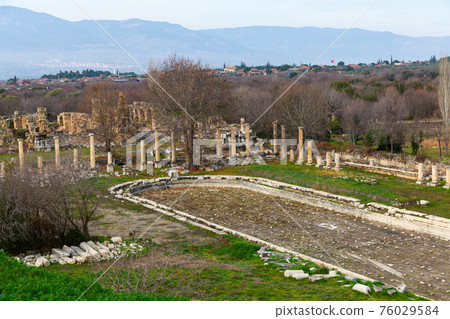 Ruins of pool surrounded by columns amidst park in Aphrodisias, Turkey Ruins of pool surrounded by columns amidst park in Aphrodisias, Turkey 76029584
