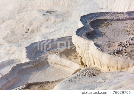 Travertines mountains of Pamukkale in Turkey. Travertines mountains of Pamukkale in Turkey. 76029705