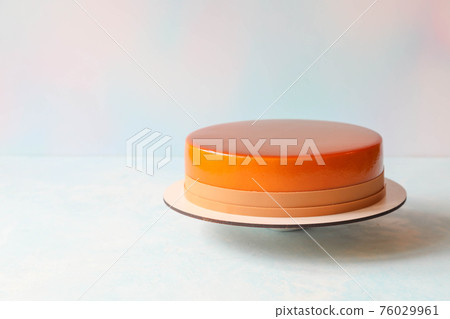Single mousse cake on a stand on a table with copy space Single mousse cake on a stand on a table with copy space 76029961