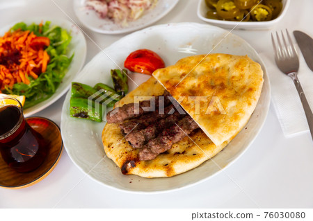 A traditional Turkish dish called Shish Kefte (Isparta sis Kofte). A traditional Turkish dish called Shish Kefte (Isparta sis Kofte). 76030080