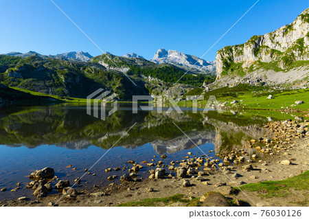 Covadonga mountain landscape reflecting in lake 76030126