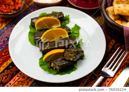 Traditional Turkish Sarma, wrapped vine leaves stuffed with rice Traditional Turkish Sarma, wrapped vine leaves stuffed with rice 76030224