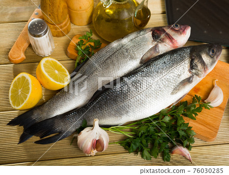 Two raw sea bass fish Two raw sea bass fish 76030285