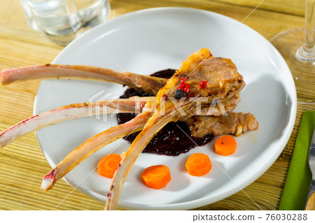 Delicious baked lamb ribs 76030288