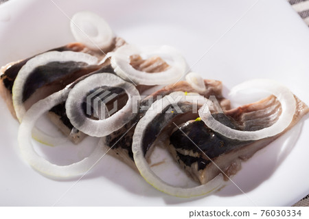 Salted herring with onions is tasty dish 76030334
