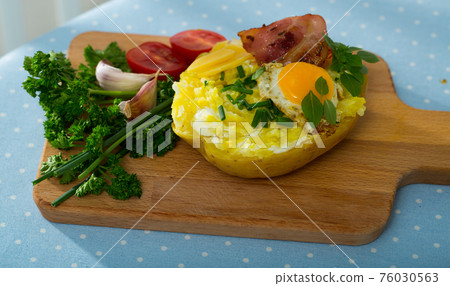 Appetizing baked potato filling with cheese 76030563