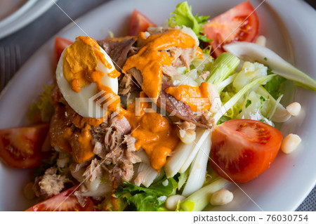 Fresh Catalan salad with Xatonada sauce Fresh Catalan salad with Xatonada sauce 76030754