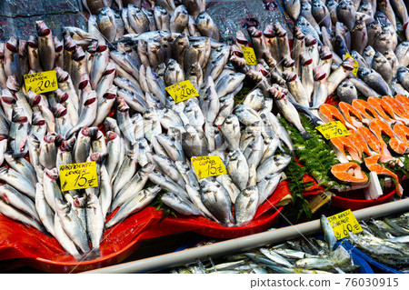 Fresh fish at seafood market in Istanbul. On the price tags names of fish in turkish 76030915