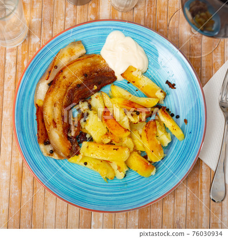 Roasted pork streaky bacon with baked potatoes 76030934