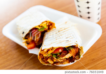 Turkish fast food, wrapped dish durum kebab Turkish fast food, wrapped dish durum kebab 76031049