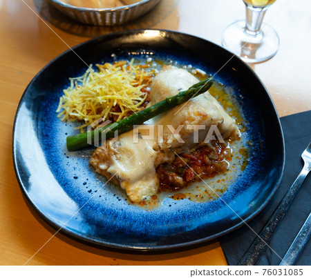 Cod fillet on vegetable ratatouille with chorizo, gratin Cod fillet on vegetable ratatouille with chorizo, gratin 76031085