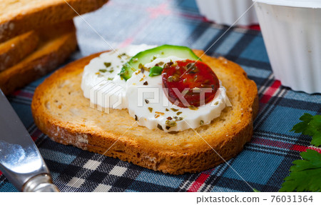 Close up image of canape with young cheese Close up image of canape with young cheese 76031364