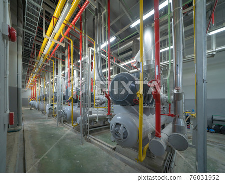 Inside of Industry factory. Chiller tower or cooling tower in building. System work machine. Condenser Water Supply and return pipe lines. Ventilation compressor. Water system in workshop. 76031952