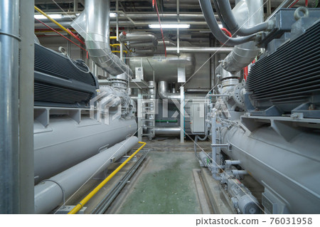 Inside of Industry factory. Chiller tower or cooling tower in building. System work machine. Condenser Water Supply and return pipe lines. Ventilation compressor. Water system in workshop. 76031958