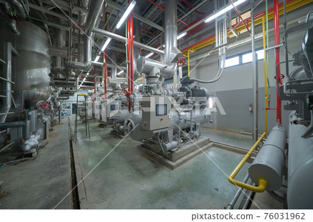 Inside of Industry factory. Chiller tower or cooling tower in building. System work machine. Condenser Water Supply and return pipe lines. Ventilation compressor. Water system in workshop. 76031962