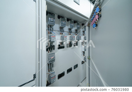 Close up of Industrial electric switch panel power plant in industry factory. Switchgear operation control station monitor manufacturing factory system. generator 76031980