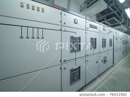 Interior of electrical room. Power energy motor machinery cabinets in control or server room, main operator station network and circuit center in industry factory manufacturing system. generator 76031992