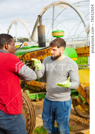 Quarrel of two farmers in greenhouse Quarrel of two farmers in greenhouse 76032604