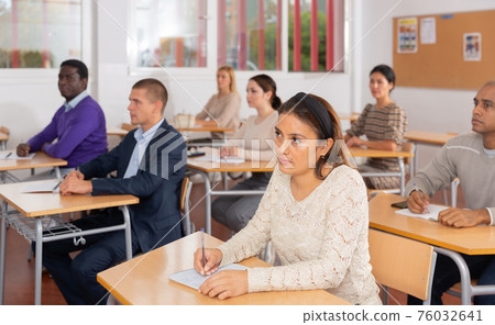 Young woman working during group business training Young woman working during group business training 76032641
