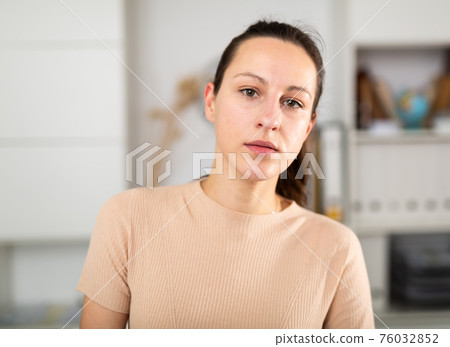 Portrait of smiling girl standing in office Portrait of smiling girl standing in office 76032852