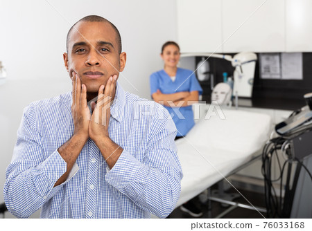 Happy male patient after procedure in aesthetic medicine office 76033168