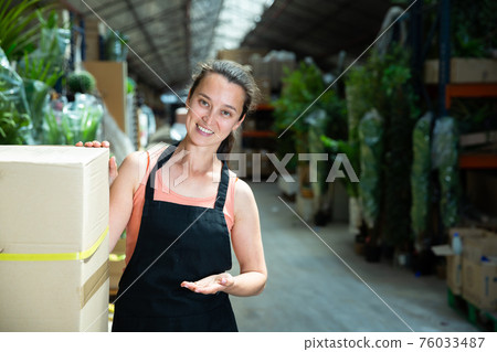 Garden store worker posing at shopping room 76033487