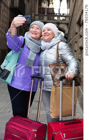Senior ladies making selfie outdoors Senior ladies making selfie outdoors 76034176