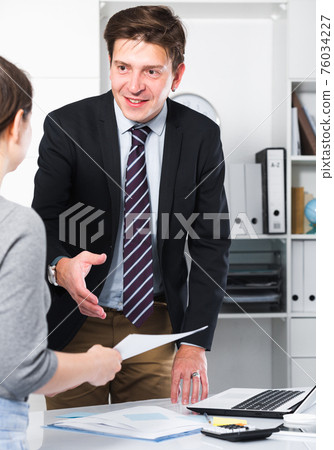 Young smiling man with companion Young smiling man with companion 76034227