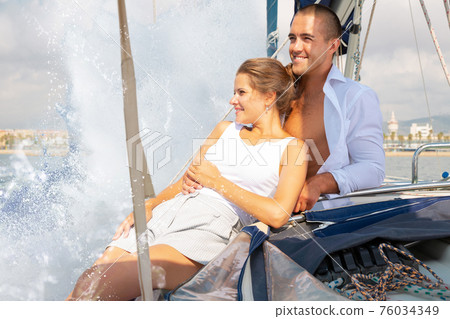Couple enjoying sea trip along coast of Barcelona 76034349