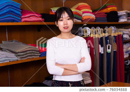 Salesgirl of clothing store 76034888