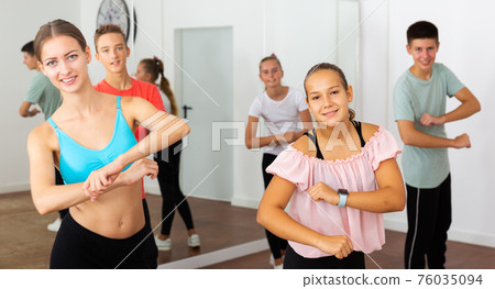 Teens practicing dance with female trainer 76035094